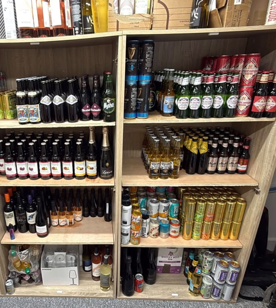 Well-stocked drinks shelves behind the bar at Tram Stop
